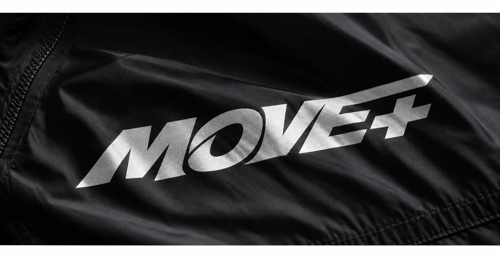 MOVE+ silver logo applied to black technical fabric