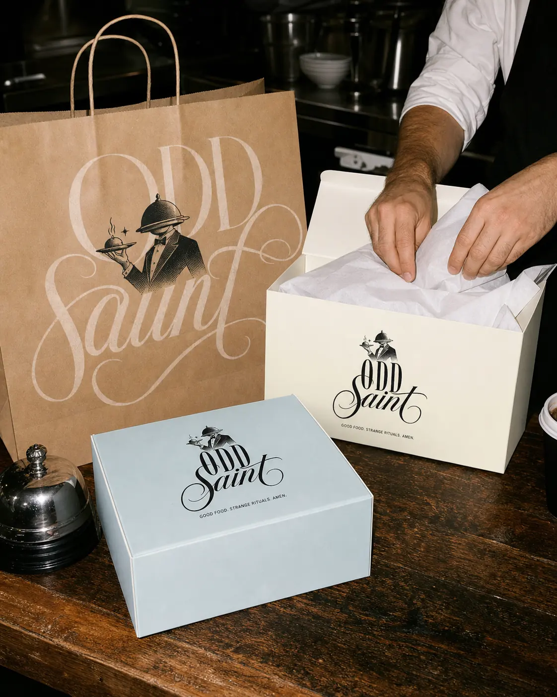 Odd Saint packaging boxes and branded carry bag system