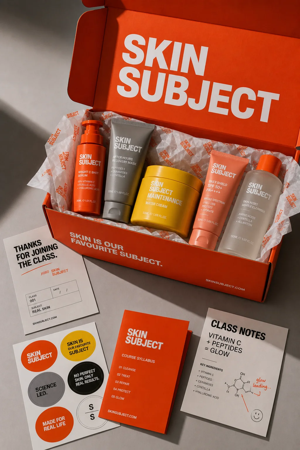 SKIN SUBJECT unboxing kit with product tubes, sample cards and orange box
